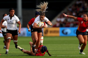 New Zealand's centre Amy du Plessis is tackled by Spain's wing Clara Piquero during the Women's Rugby World Cup. (Photo by Adrian Dennis / AFP)