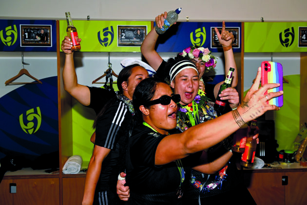 Arihiana Marino-Tauhinu, Ayesha Leti-l'iga and Charmaine McMenamin of the New Zealand Black Ferns celebrate after winning the Rugby World Cup 2021. (Photo by Hannah Peters - World Rugby/World Rugby via Getty Images)