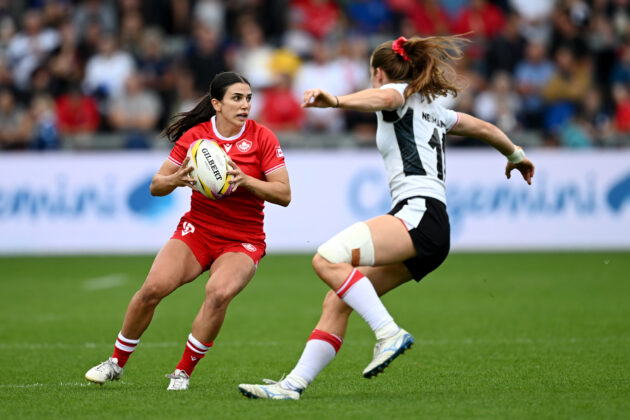 Canada's Julia Schell attempts to get past Wales' Lisa Neumann during the 2025 Women’s Rugby World Cup pool match