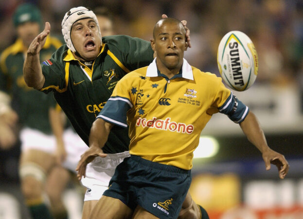 Australia's George Gregan is tackled by South Africa's De Wet Barry during a 2002 Test