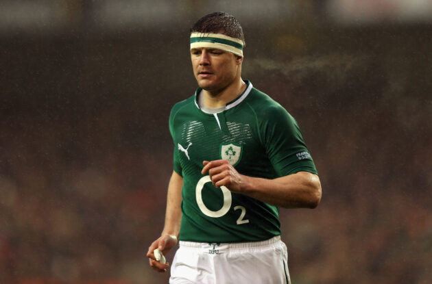 Ireland's Brian O'Driscoll runs across the field with head bandage during the 2013 Six Nations game against France.