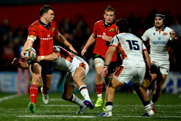 Munster's Tom Farrell attempts to offload during a tackle in the October 2025 URC match against Edinburgh
