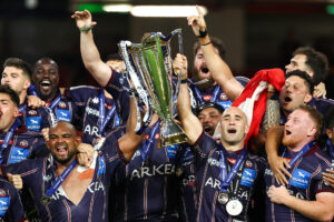 Jefferson Poirot and Maxime Lucu lead the celebrations after Bordeaux Begles Champions Cup victory in London in 2025.