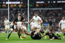 New Zealand's Beauden Barrett and Cam Roigard tackle England's Immanuel Feyi-Waboso during the 2025 Autumn Nations Series match at Twickenham