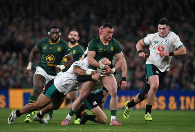 South Africa's Jesse Kriel is tackled by Ireland's Sam Prendergast and Bundee Aki during the November 2025 international match