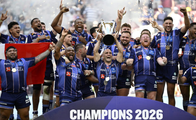 Bordeaux Bègles players celebrate with the trophy after winning the 2025-26 European Champions Cup in Bilbao