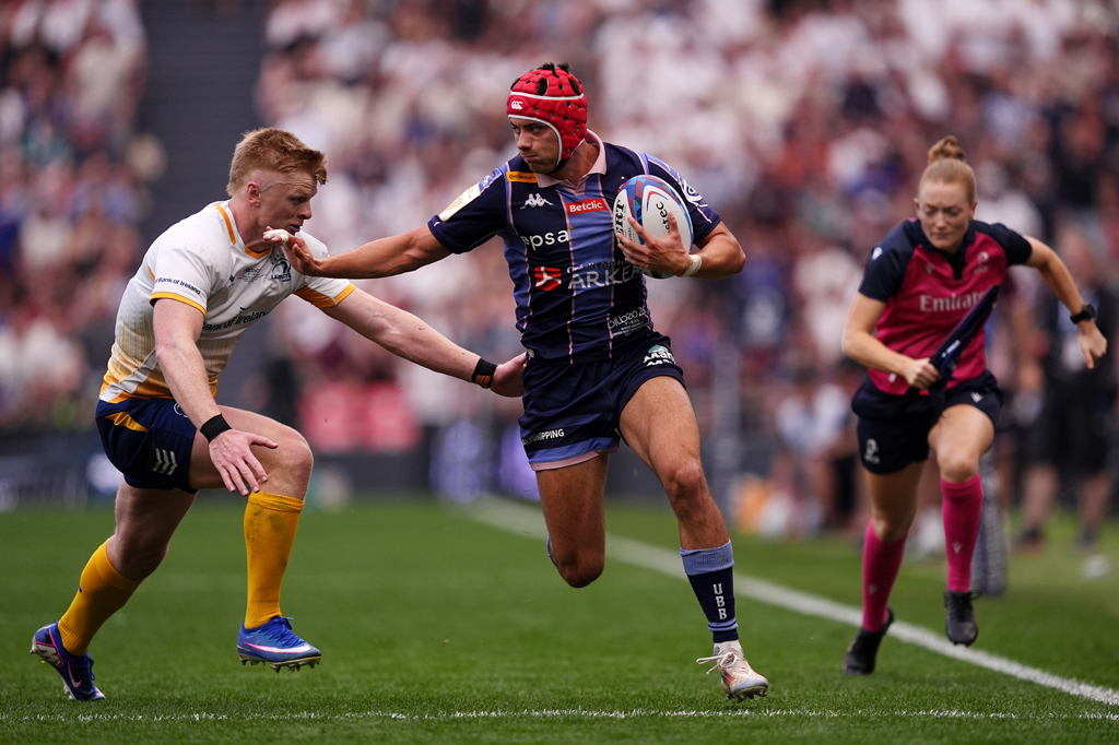 Louis Bielle-Biarrey of Bordeaux Begles evades the tackle of Tommy O'Brien of Leinster during the 2026 European Champions Cup final