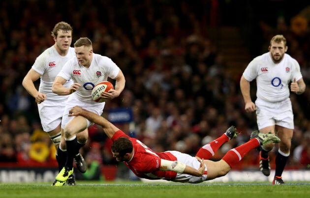 England's Chris Ashton runs through a tackle from Jamie Roberts of Wales during the 2013 Six Nations match