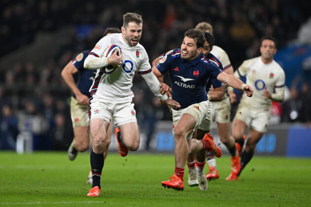 England's Elliot Daly tries to evade France’s Antoine Dupont