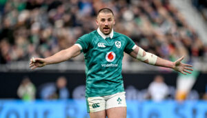 Ireland’s Stuart McCloskey with his arms outstretched in Ireland’s November 2025 match against New Zealand