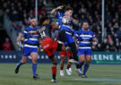 Henry Arundell of Bath beats Saracens' Noah Caluori to a high ball during the teams' 2025 PREM Rugby encounter.