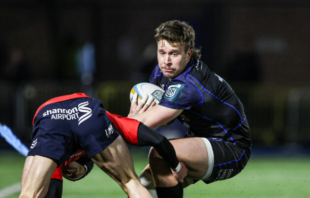 Glasgow Warriors' Kyle Rowe evades a tackle during the January URC match against Munster.