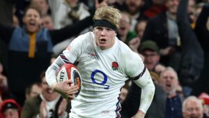 Henry Pollock of England breaks with the ball to score his first try on his international debut during the Guinness Six Nations 2025 match between Wales and England at the Principality Stadium on March 15, 2025 in Cardiff, Wales.