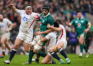 Ireland’s Caelan Doris is tackled by a trio of England players during the 2026 Six Nations match