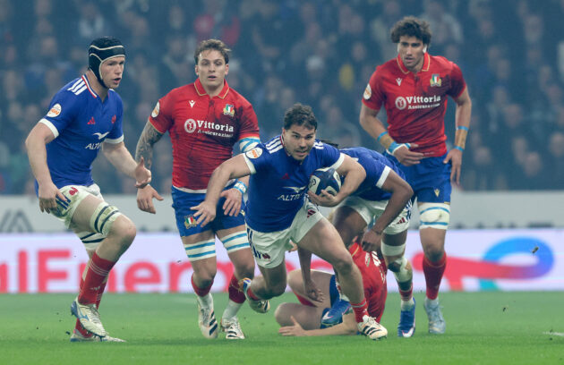 France's Antoine Dupont runs away from Italy defenders during the 2026 Six Nations match
