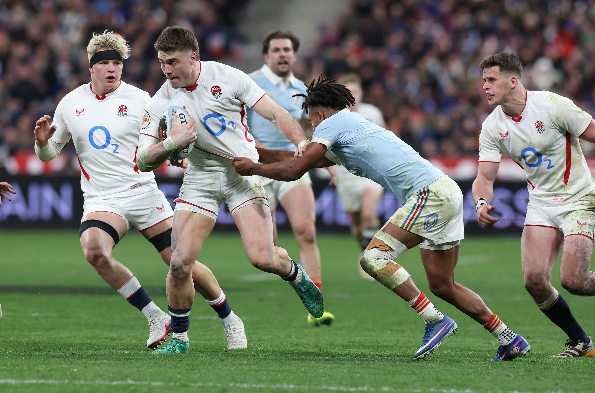 England's Tommy Freeman is tackled by Theo Attissogbe during the Guinness Six Nations 2026 match against France