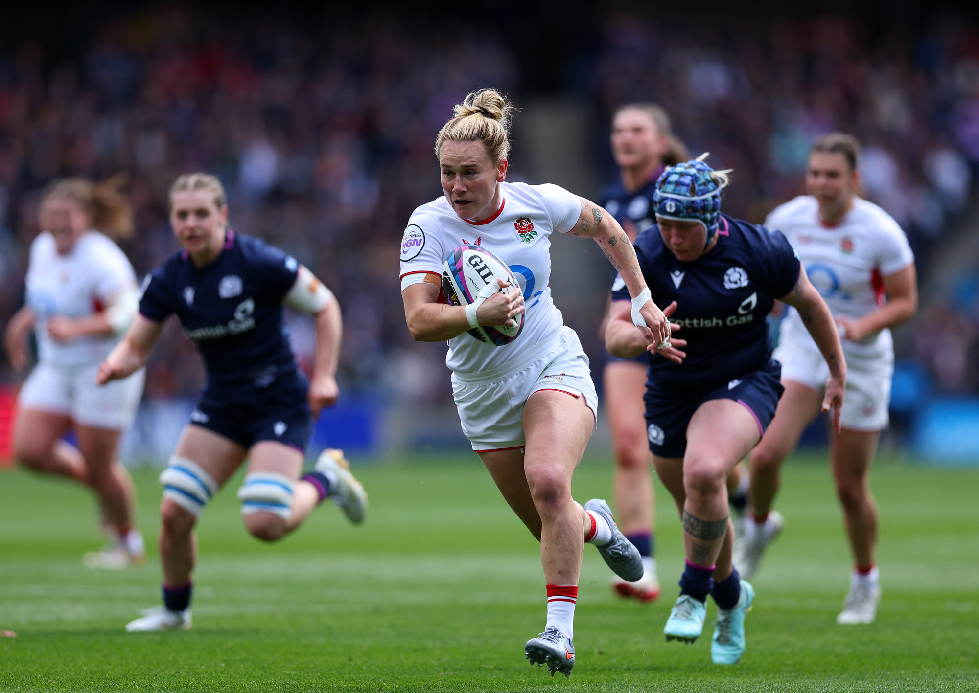 England's Meg Jones runs with the ball during the 2026 Women's Six Nations match against Scotland