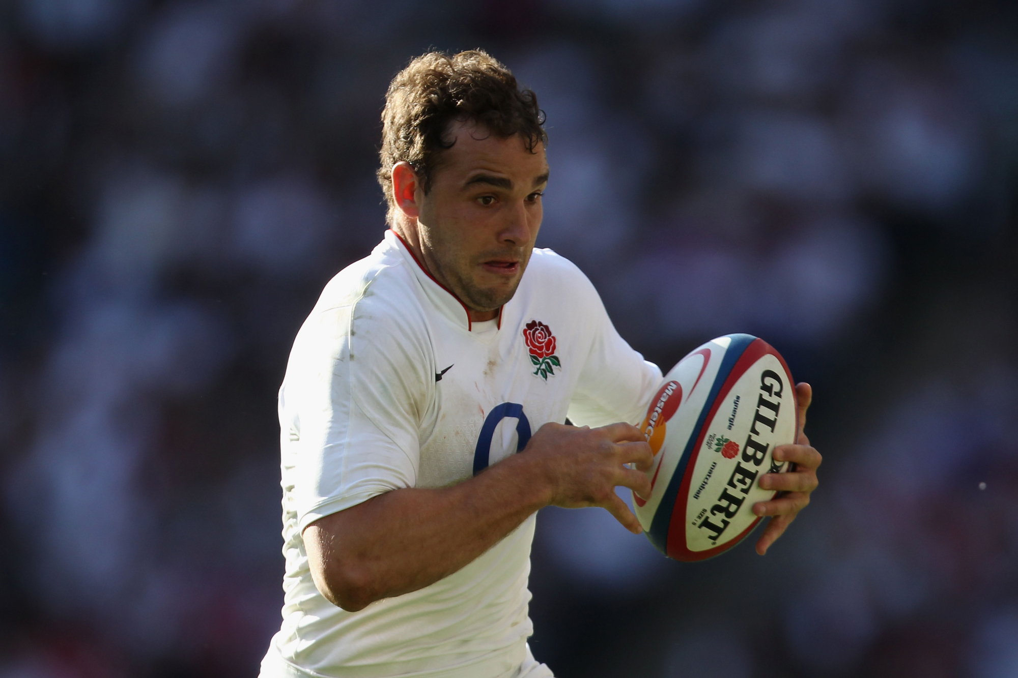 England’s Olly Barkley runs with the ball during a May 2010 match against the Barbarians.