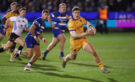Northampton Saints' Tommy Freeman runs away from Bath players during the December 2025 Gallagher Prem encounter