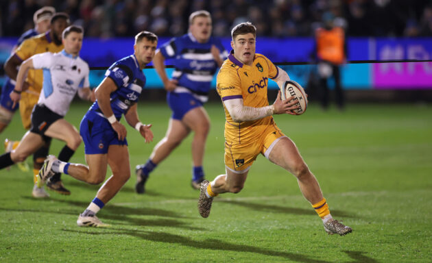 Northampton Saints' Tommy Freeman runs away from Bath players during the December 2025 Gallagher Prem encounter