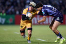 Northampton Saints' Henry Pollock fends off a tackle from Bordeaux Bègles' Nicolas Depoortere during the January 2026 European Champions Cup match.