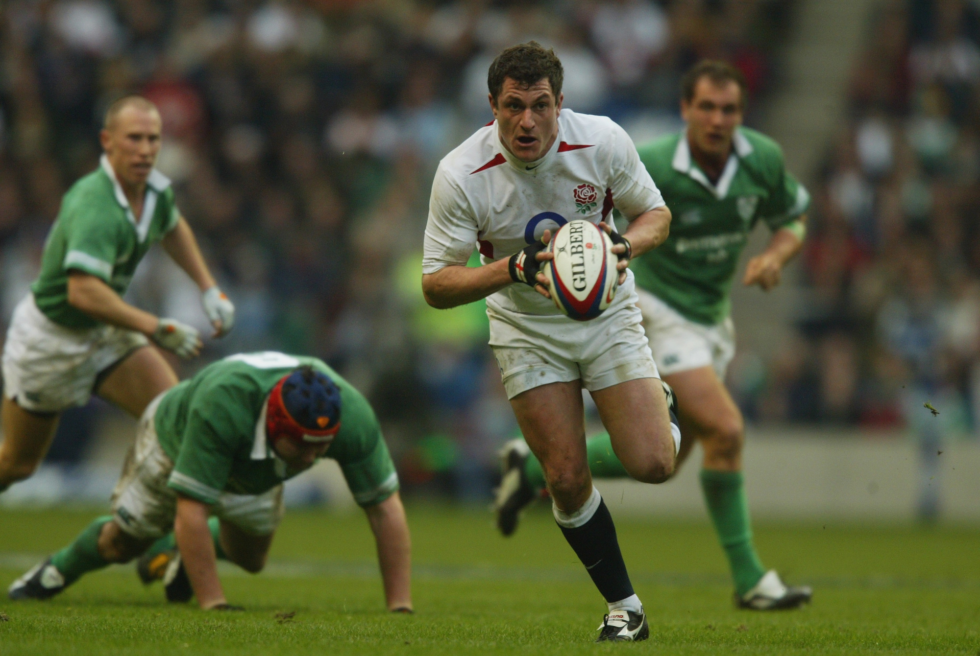 England's Paul Grayson makes a break during the 2004 Six Nations match against Ireland