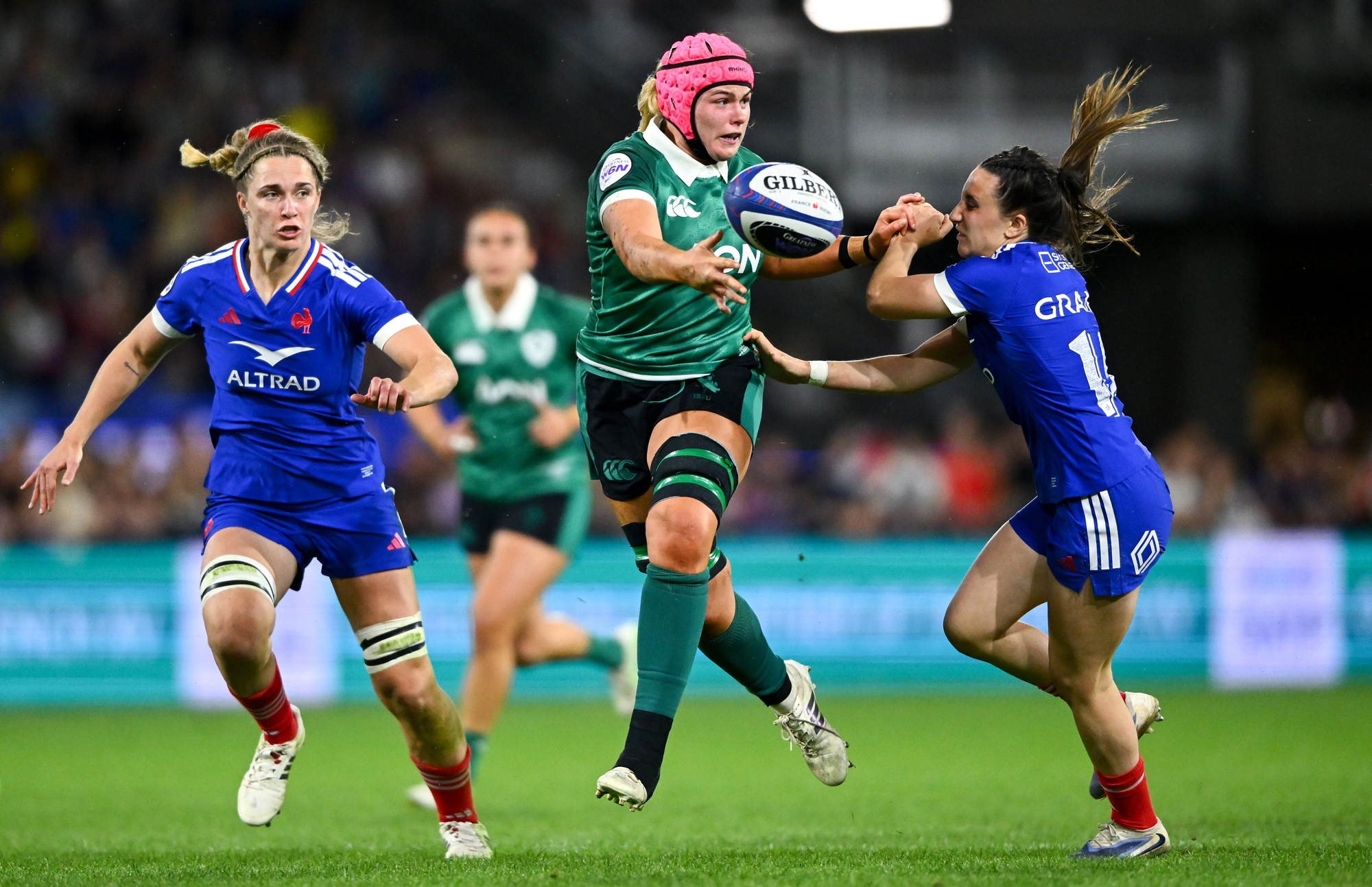 Ireland's Dorothy Wall runs with the ball as France's Anais Grando attempts a challenge during the 2026 Six Nations encounter