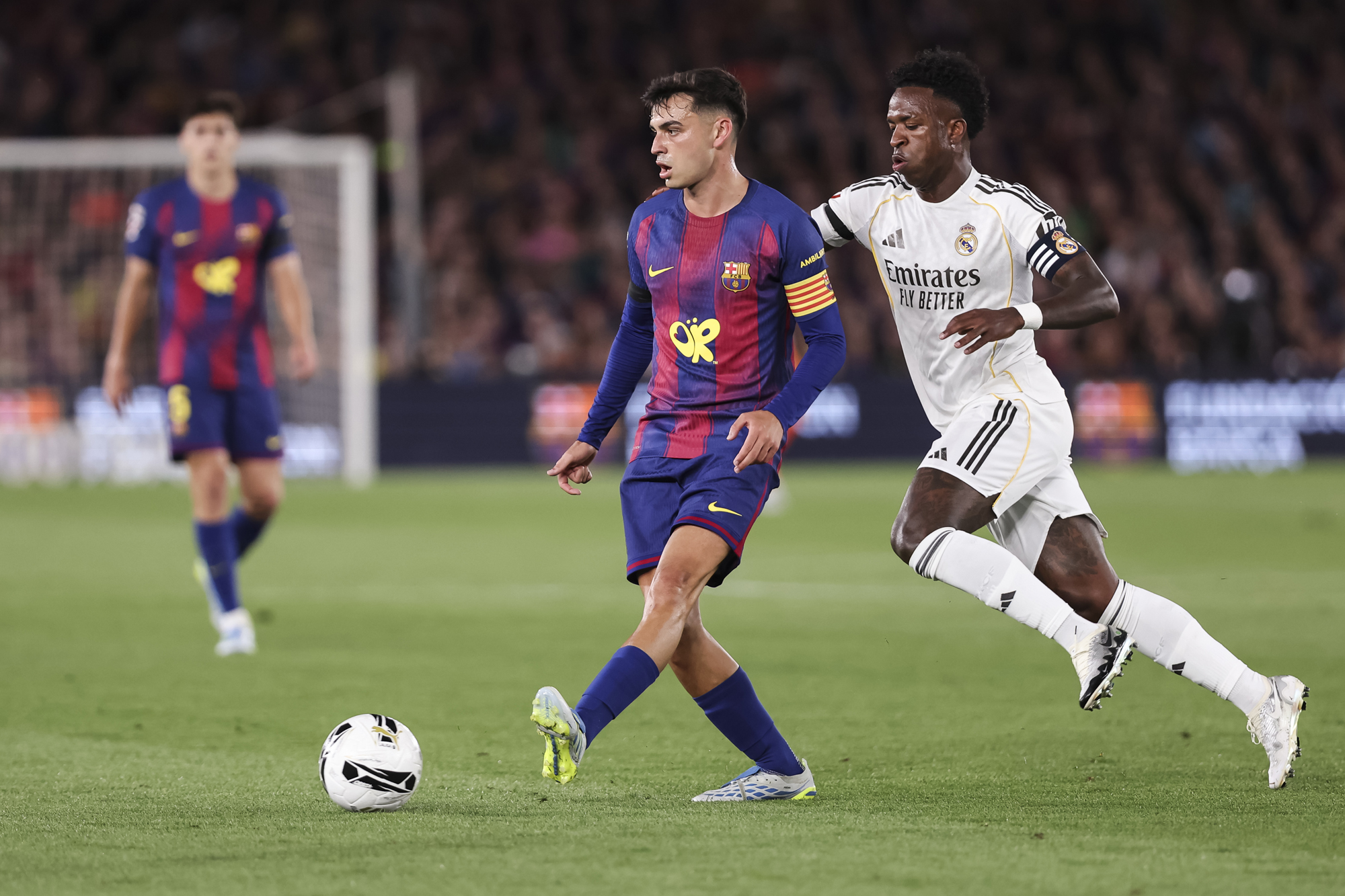Barcelona's Pedri and Real Madrid's Vinicius Jr tussle for the ball during the May 2026 El Clasico in La Liga