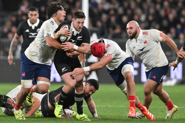 New Zealand's Cam Roigard is tackled by France's defence during the first test between the sides in July 2025