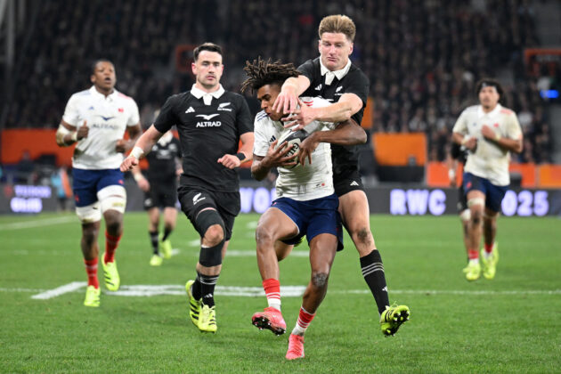 France's Theo Attissogbe is tackled by New Zealand’s Jordie Barrett during the July 2025 test in Dunedin.