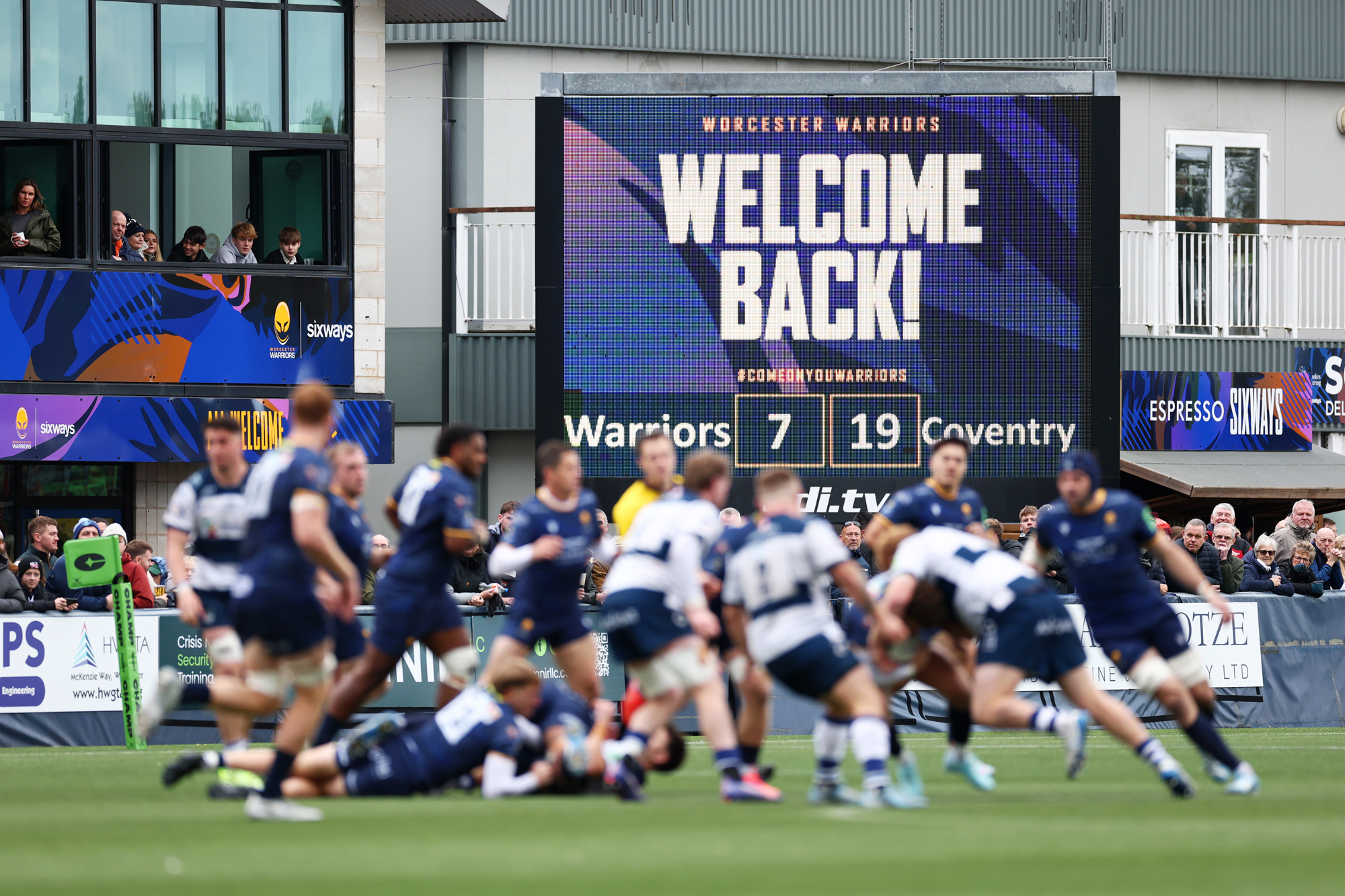 A "Welcome Back" sign at Worcester Warriors' October 2025 Champ match against Coventry.