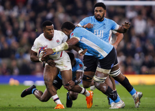 England's Immanuel Feyi-Waboso tries to evade a tackle from Fiji players during the November 2025 international at Twickenham