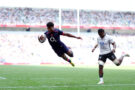 Noah Caluori dives to score a try for England on his international debut against Fiji