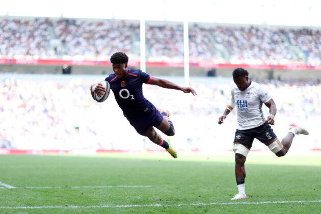 Noah Caluori dives to score a try for England on his international debut against Fiji