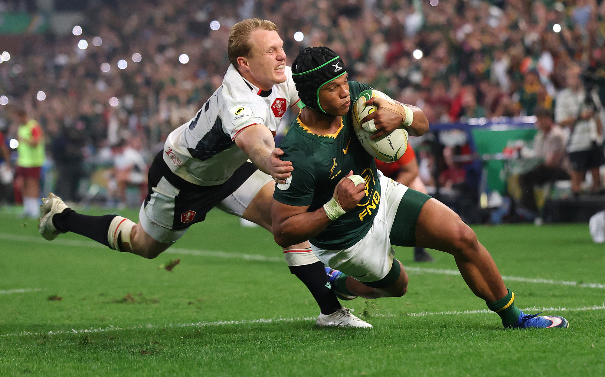 Wales Blair Murray attempts to stop Kurt-Lee Arendse from scoring South Africa's sixth try during the July 2026 Nations Championship match