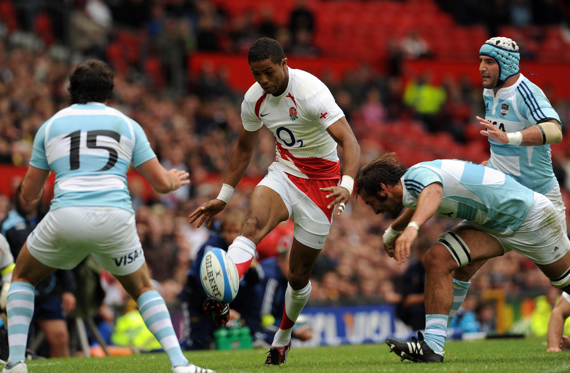 England's Delon Armitage kicks through for Matt Banahan during a 2009 international at Old Trafford, Manchester