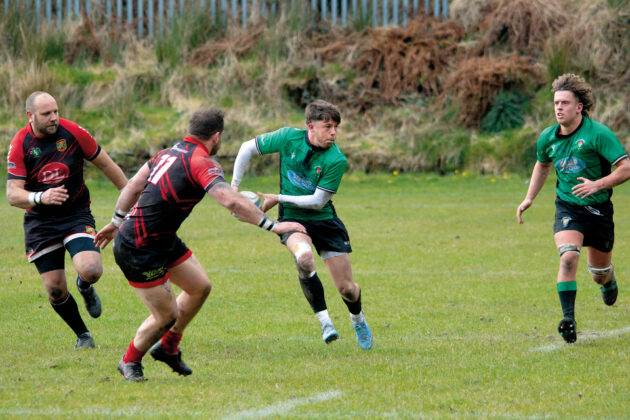 A Cambrian player prepares to pass the ball in their match against Rhydyfelin