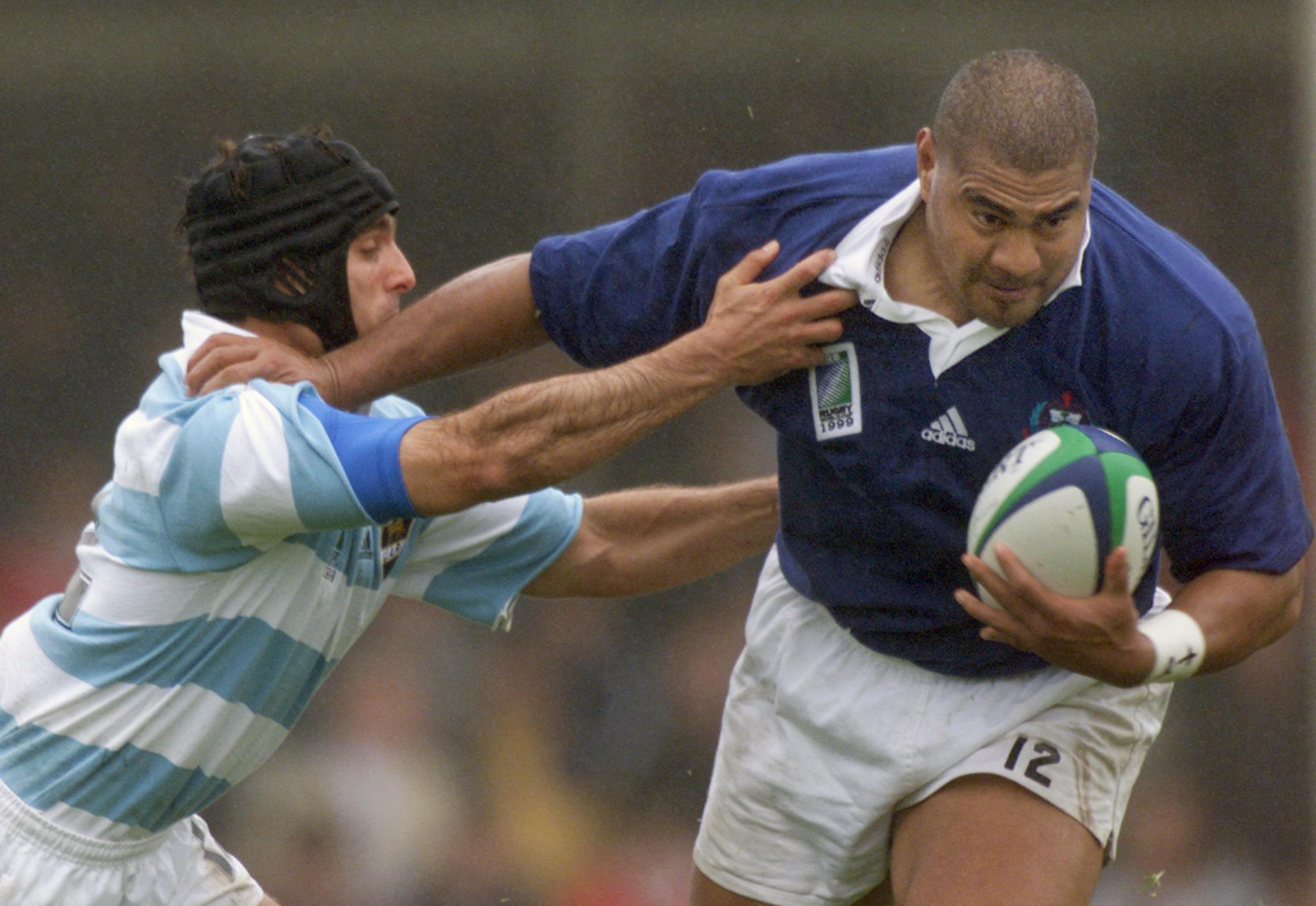 Samoa’s Va'aiga Tuigamala breaks a tackle during a 1999 World Cup match against Argentina