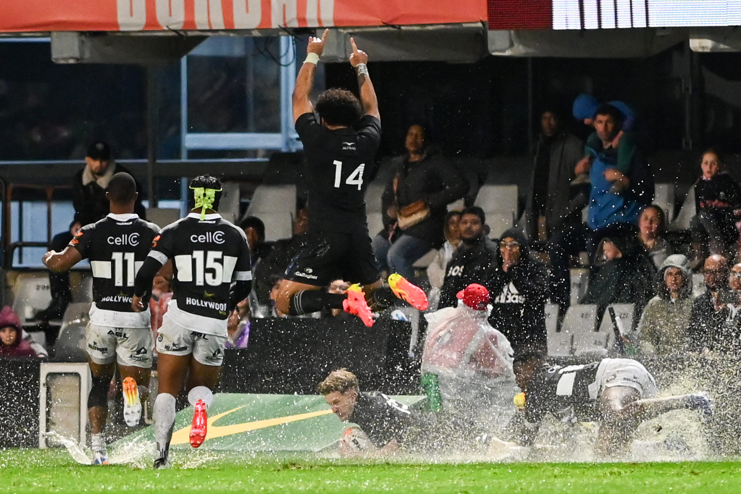 ehi Fineanganofo of New Zealand All Blacks leaps over Damian McKenzie of New Zealand All Blacks scoring a try during the match between Hollywoodbets Sharks and New Zealand at Hollywoodbets Kings Park Stadium on August 11, 2026 in Durban, South Africa. (Photo by Steve Haag Sports/Gallo Images/Getty Images)