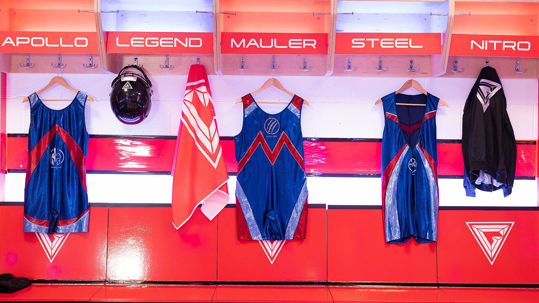 A row of Gladiator vests in a dressing room, focused on Joe Marler's Mauler shirt.