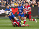 Bath’s Finn Russell passes the ball under pressure from Gloucester during the October 2025 Gallagher PREM match.