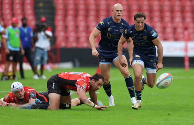 Jared Rosser and Cai Evans of Dragons chase the ball during the March 2026 URC match against the Lions.