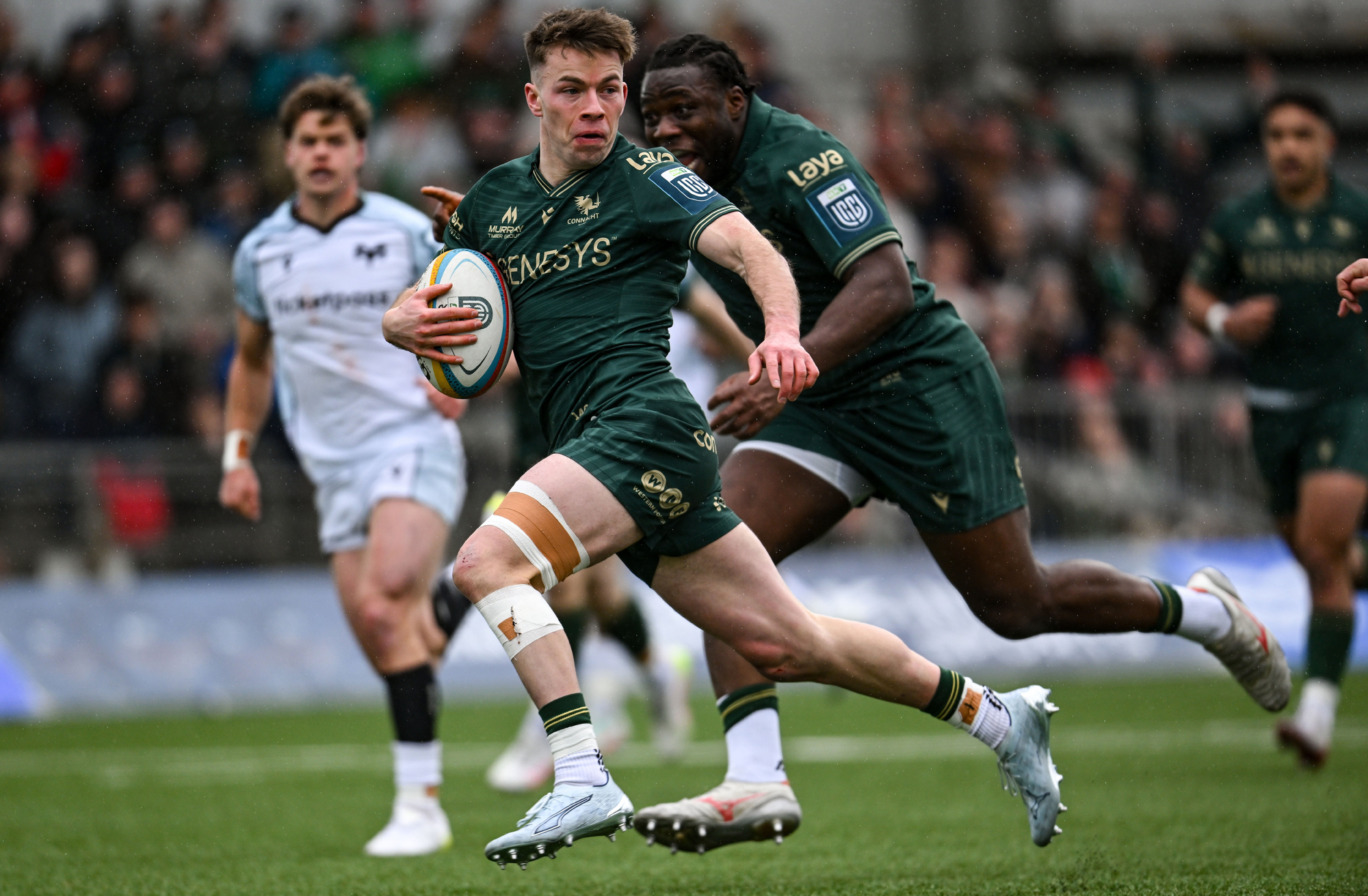 Connacht’s Matthew Devine runs with the ball on his way to scoring a try during the March 2026 URC match against Ospreys