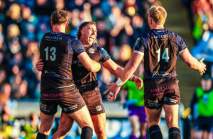 Glasgow Warriors' Josh McKay celebrates a try with Stafford McDowall and Kyle Steyn during the May 2026 URC match against Connacht