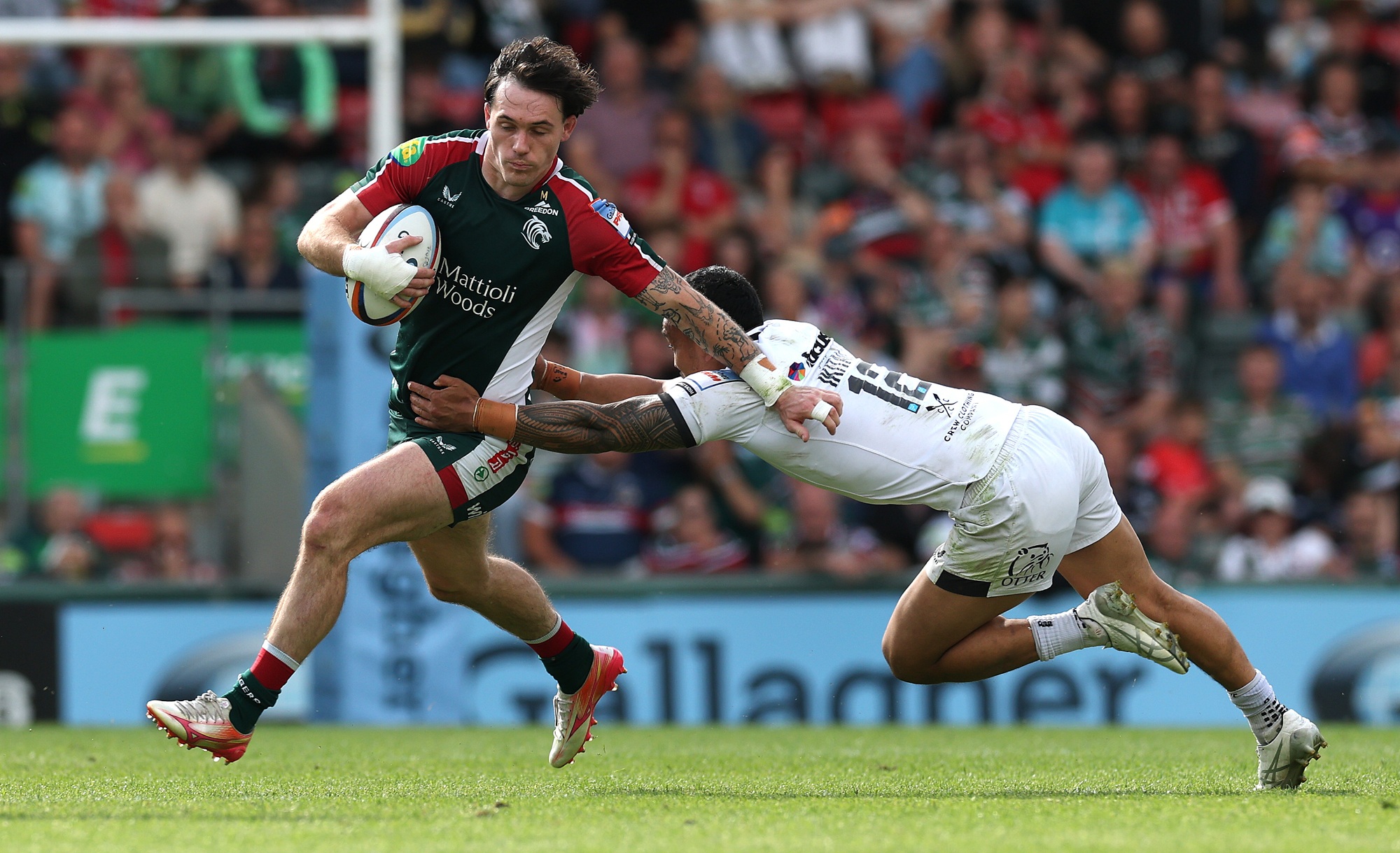 Will Wand of Leicester is tackled by Exeter Chiefs' Len Ikitau during a May 2026 Gallagher PREM match.