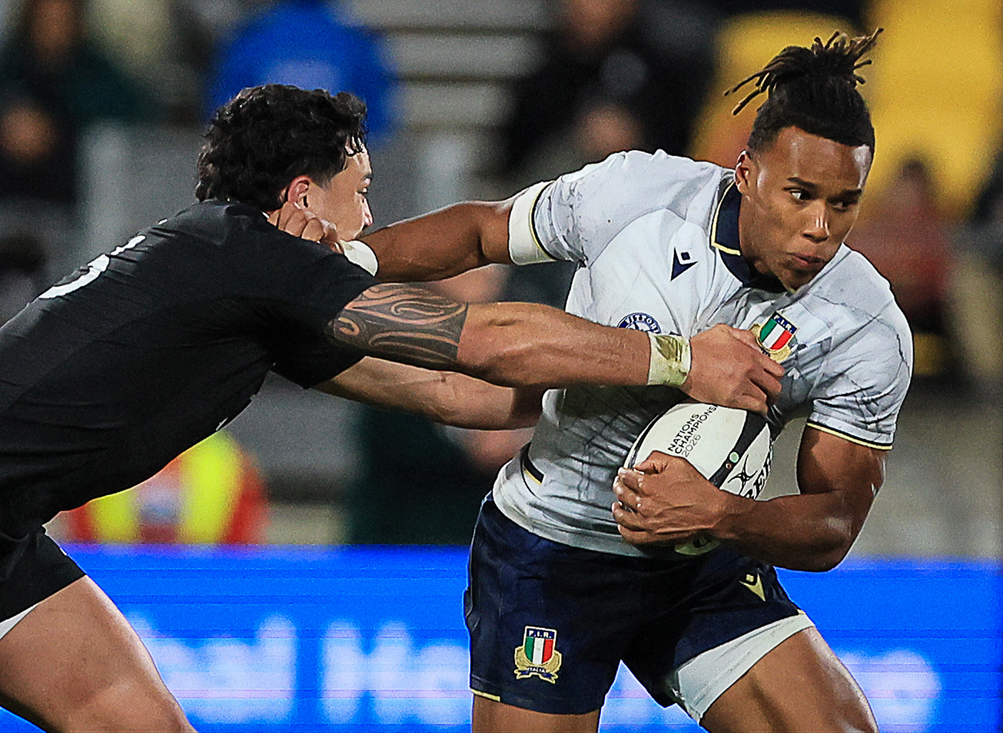 Italy's Malik Faissal evades a tackle from New Zealand's Billy Proctor during the July 2026 Nations Championship match