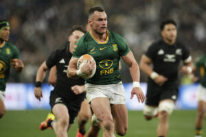 South Africa's Jesse Kriel runs with the ball on his way to scoring a try against New Zealand in the third Greatest Rivalry Test in Johannesburg