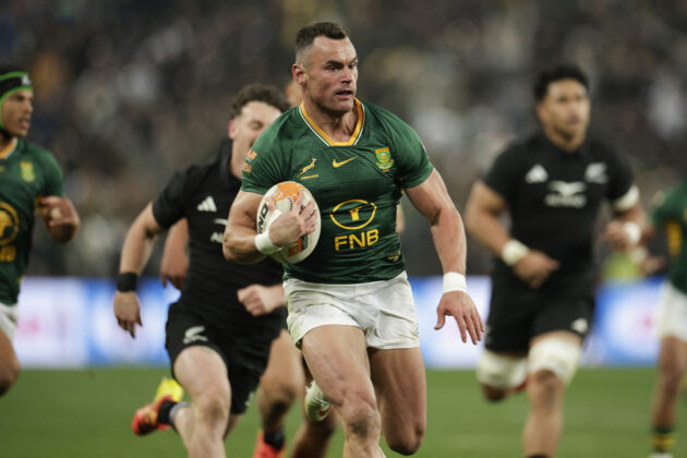 South Africa's Jesse Kriel runs with the ball on his way to scoring a try against New Zealand in the third Greatest Rivalry Test in Johannesburg