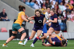 England's Ellie Kildunne runs with the ball under pressure from Australia's Michaela Leonard during the September 2026 WXV Global Series encounter