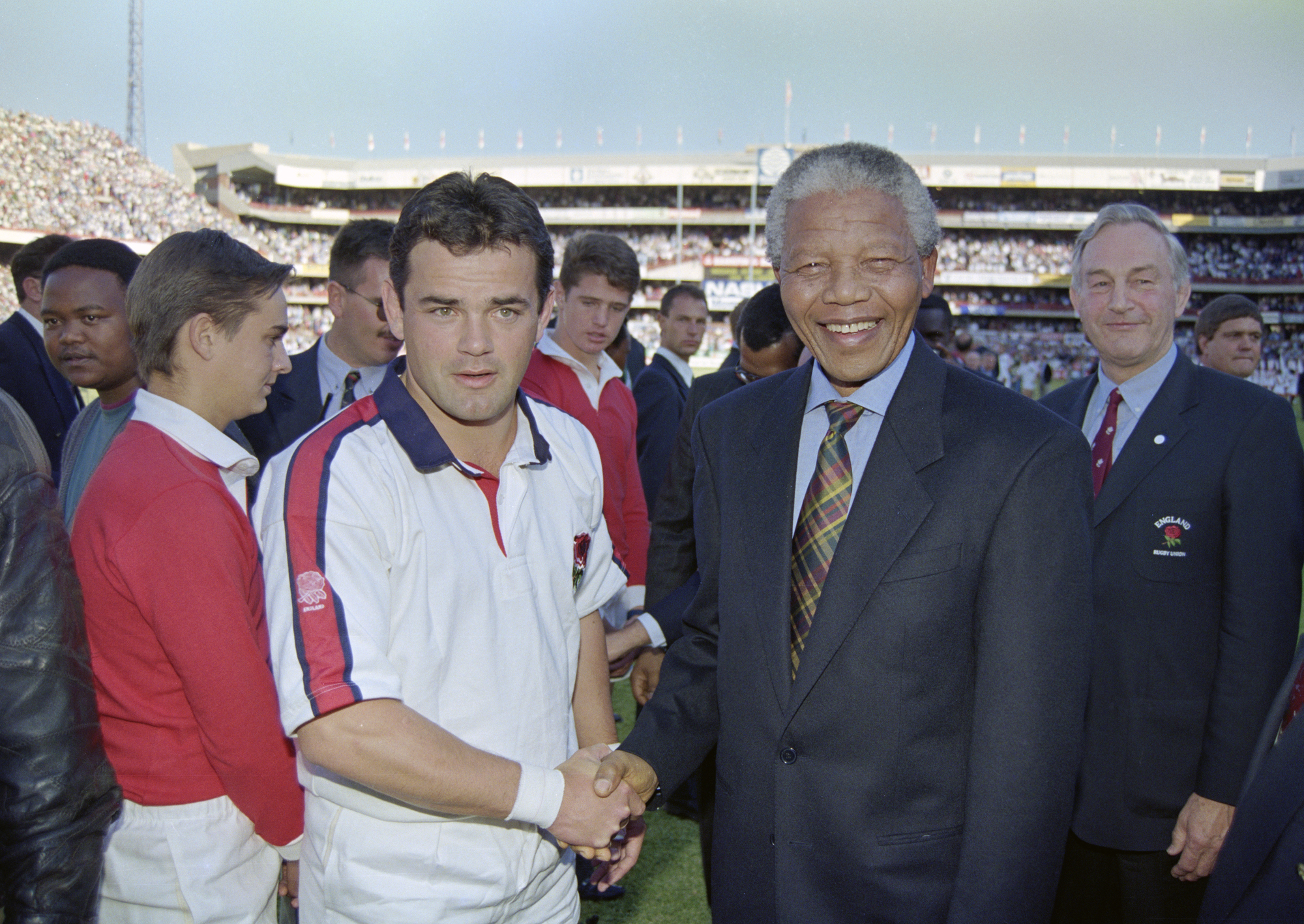 England captain Will Carling shakes hands with Nelson Mandela ahead of the first Test against the Springboks in Pretoria in June 1994